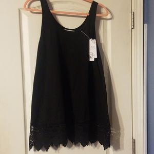 Lace trimmed sleeveless black top. 1X